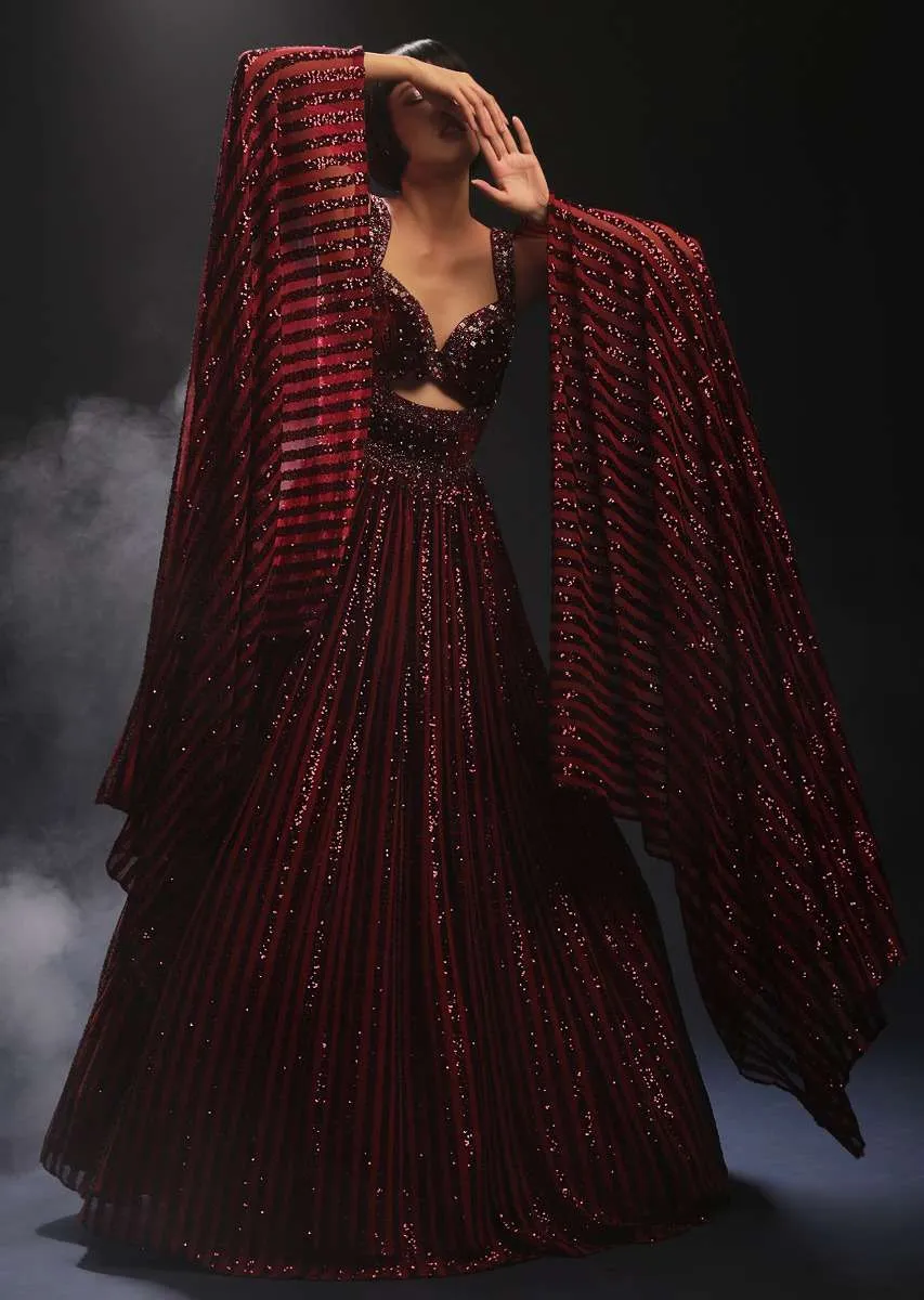 Burgundy Gown In Sequins Embellished Net With Attached Cape And Cut Dana Accented Front Cut Bodice